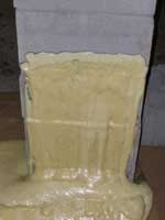 Foam as water barrier on outside of block wall